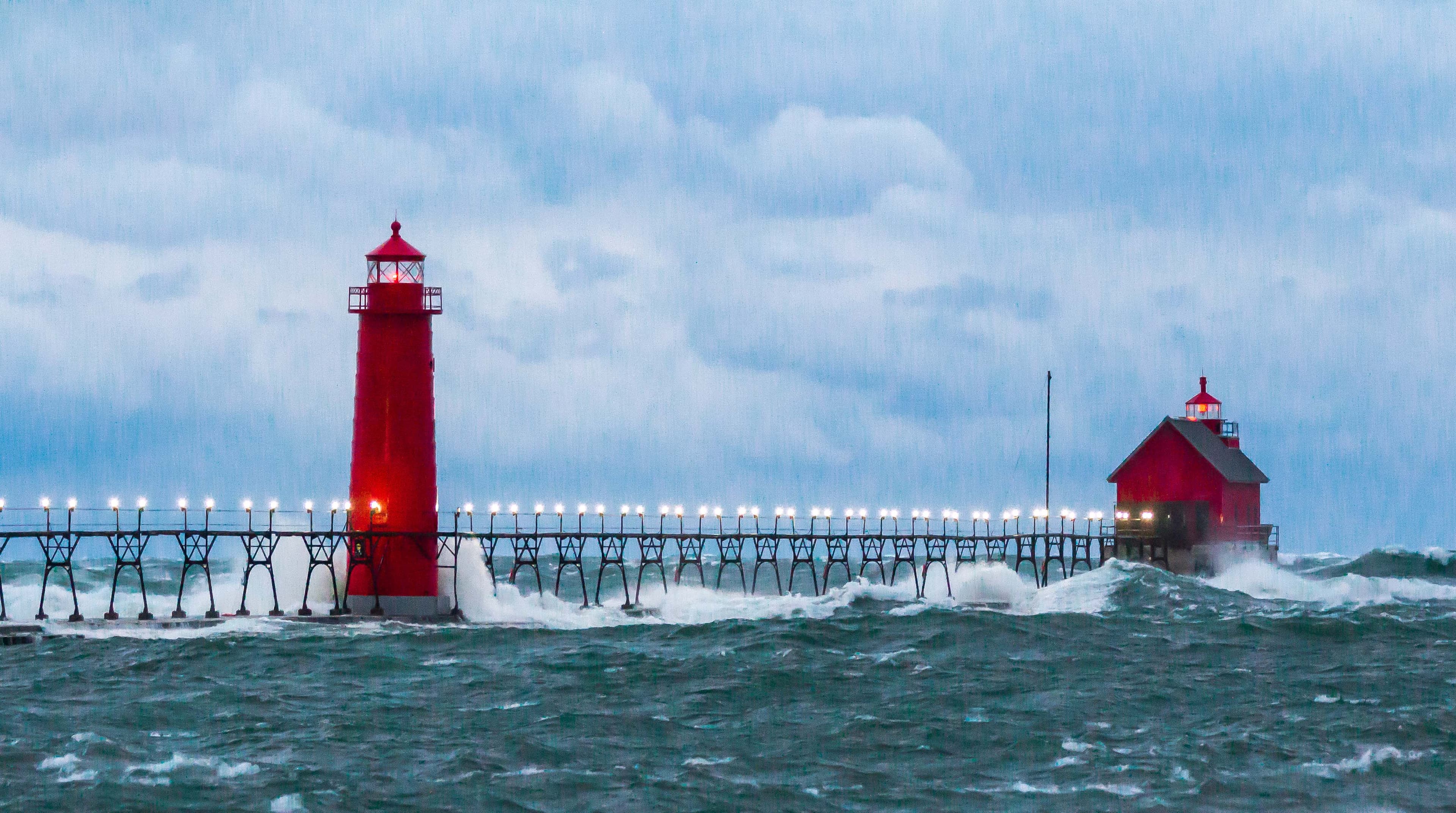 Dramatic storm waves at Michigan lighthouse - perfect photography opportunity