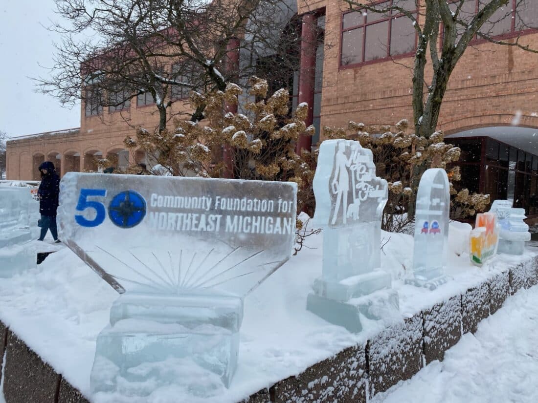 Alpena Ice Festival celebration with ice sculptures and winter activities on Thunder Bay