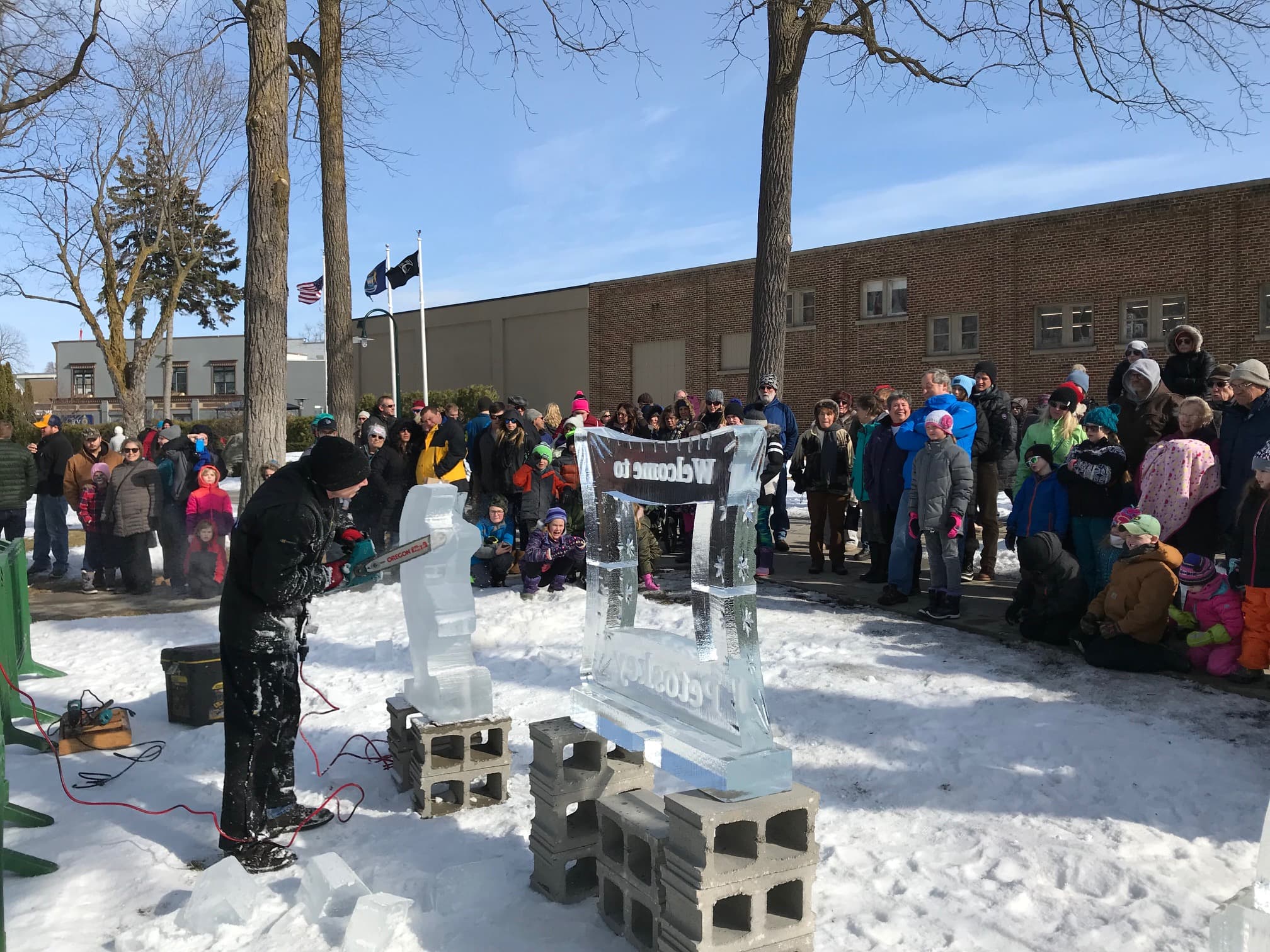 Petoskey Winterfest celebration with ice sculptures along Little Traverse Bay